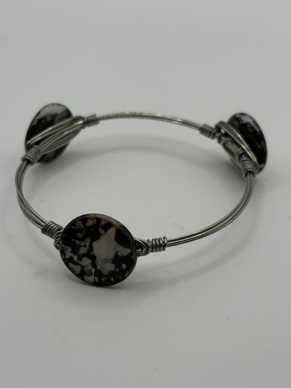 Bourbon and Bowties Silver Wire Bracelet with Black and White abalone Discs
